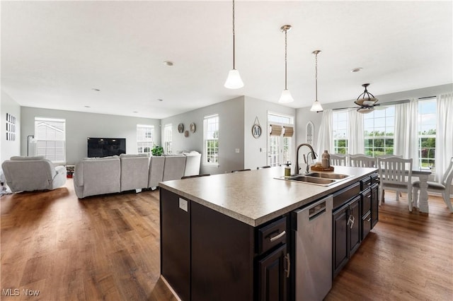 2979 Cloverhurst St NE, Canton, OH 44721 - kitchen featuring dishwasher, wood finished floors, plenty of natural light, and decorative light fixtures