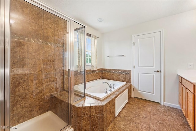2979 Cloverhurst St NE, Canton, OH 44721 - full bathroom with a stall shower, a bath, vanity, and tile patterned floors