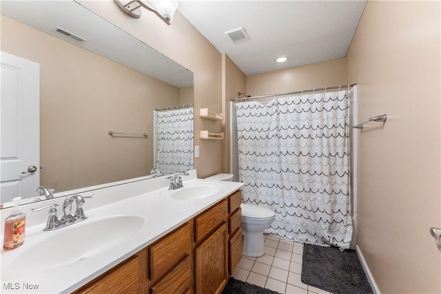2979 Cloverhurst St NE, Canton, OH 44721 - bathroom featuring tile patterned floors, double vanity, and a shower with shower curtain