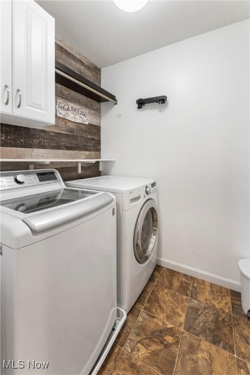 2979 Cloverhurst St NE, Canton, OH 44721 - laundry room with washer and clothes dryer and cabinet space