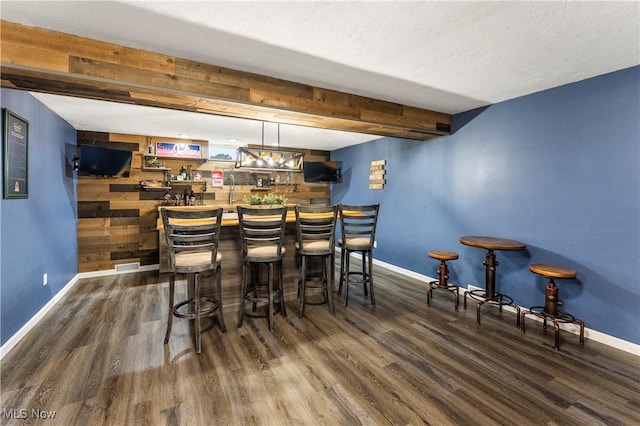 2979 Cloverhurst St NE, Canton, OH 44721 - indoor wet bar featuring wood finished floors and baseboards