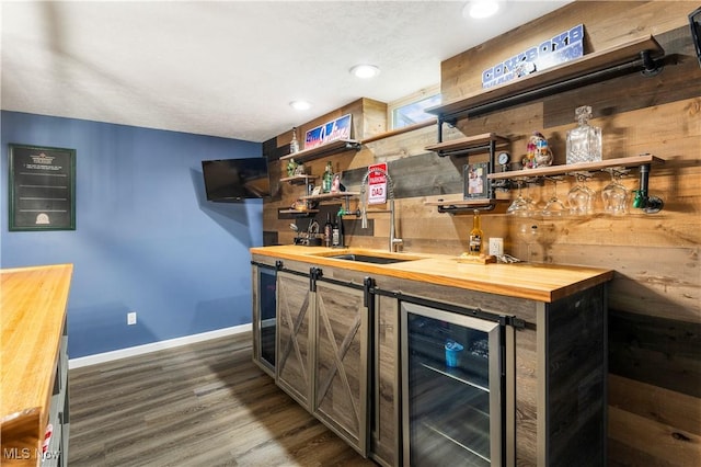 2979 Cloverhurst St NE, Canton, OH 44721 - indoor bar with wine cooler, dark wood-type flooring, and recessed lighting