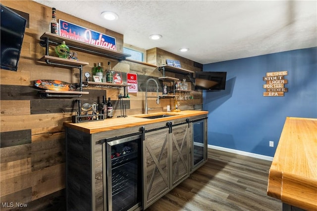 2979 Cloverhurst St NE, Canton, OH 44721 - indoor wet bar with beverage cooler, dark wood-style floors, and recessed lighting