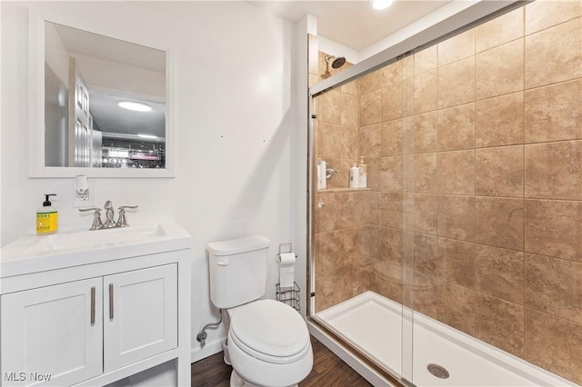2979 Cloverhurst St NE, Canton, OH 44721 - bathroom featuring a stall shower, vanity, and wood finished floors