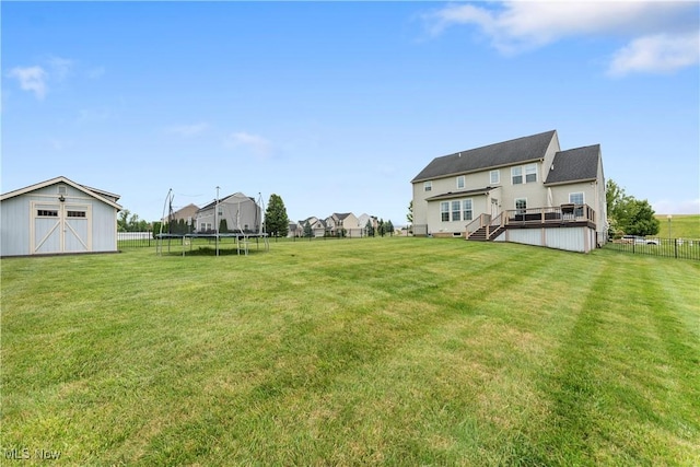 2979 Cloverhurst St NE, Canton, OH 44721 - view of yard featuring a trampoline, a wooden deck, a shed, a residential view, and stairs