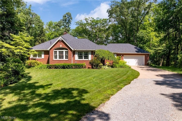 10400 Stoneacre St NW, Canal Fulton, OH 44614 - ranch-style home with driveway, a garage, a front yard, brick siding, and a chimney