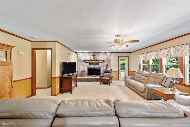 10400 Stoneacre St NW, Canal Fulton, OH 44614 - living room featuring light carpet, a ceiling fan, a brick fireplace, crown molding, and a textured ceiling