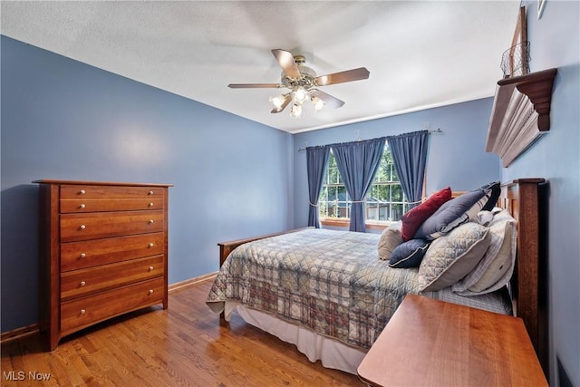 10400 Stoneacre St NW, Canal Fulton, OH 44614 - bedroom with wood finished floors and ceiling fan