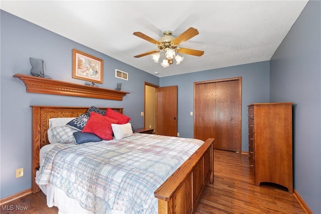10400 Stoneacre St NW, Canal Fulton, OH 44614 - bedroom featuring wood finished floors, a closet, and a ceiling fan