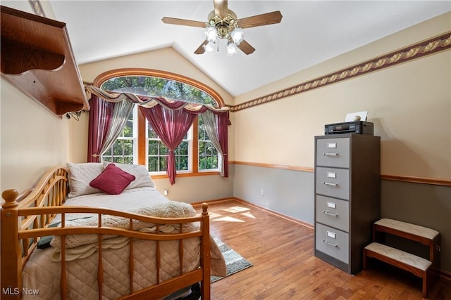 10400 Stoneacre St NW, Canal Fulton, OH 44614 - bedroom with lofted ceiling, wood-type flooring, and ceiling fan