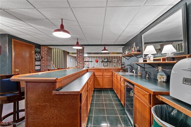 10400 Stoneacre St NW, Canal Fulton, OH 44614 - indoor wet bar featuring beverage cooler, a drop ceiling, and dark tile patterned floors