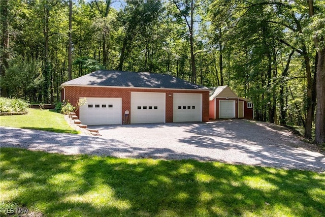 10400 Stoneacre St NW, Canal Fulton, OH 44614 - detached garage featuring a view of trees