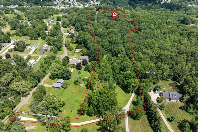 10400 Stoneacre St NW, Canal Fulton, OH 44614 - aerial view of property and surrounding area featuring property parcel outlined and a forest