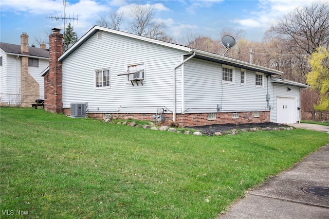 127 Brush Rd, Richmond Heights, OH 44143 - view of home's exterior with an attached garage, a yard, and concrete driveway