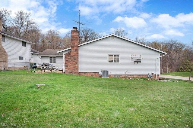 127 Brush Rd, Richmond Heights, OH 44143 - rear view of property featuring a chimney