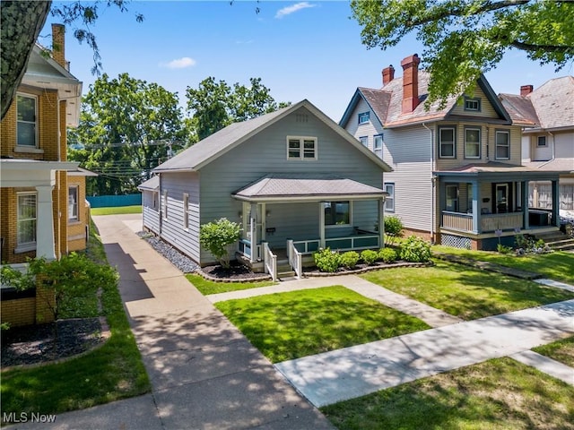 813 3rd St, Marietta, OH 45750 - view of front of home featuring covered porch and a front yard