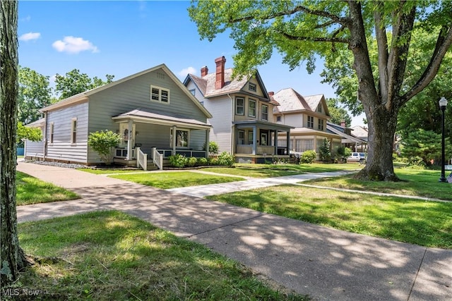 813 3rd St, Marietta, OH 45750 - victorian house with a porch and a front yard