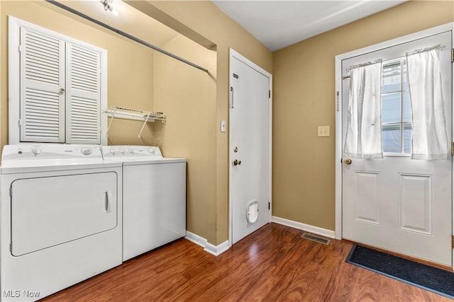 813 3rd St, Marietta, OH 45750 - laundry room with wood finished floors and washing machine and clothes dryer