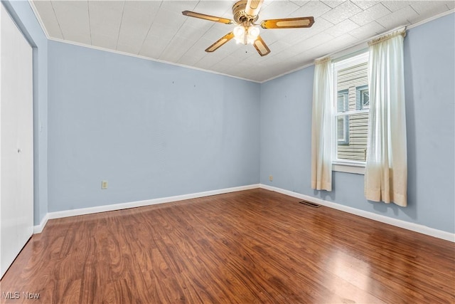 813 3rd St, Marietta, OH 45750 - unfurnished room with wood finished floors, crown molding, and a ceiling fan