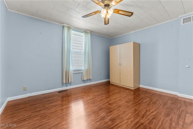 813 3rd St, Marietta, OH 45750 - unfurnished room with ornamental molding, wood finished floors, and ceiling fan