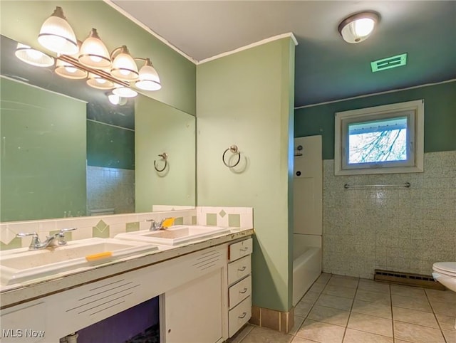 3189 Union Ave SE, Minerva, OH 44657 - full bathroom with tile patterned floors, tile walls, double vanity, shower / washtub combination, and ornamental molding
