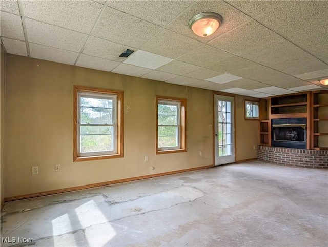 3189 Union Ave SE, Minerva, OH 44657 - unfurnished living room featuring a fireplace and a paneled ceiling