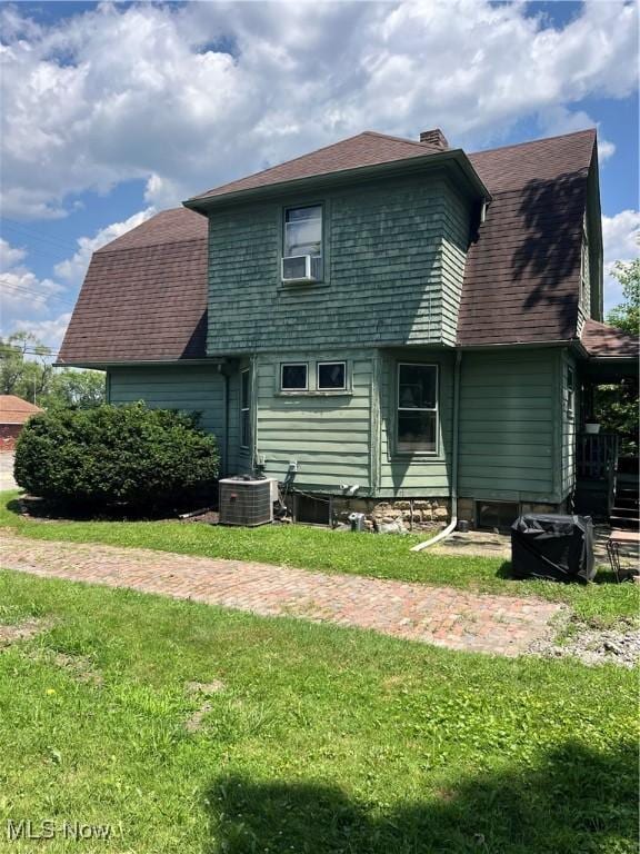 13 Neil St, Niles, OH 44446 - rear view of property with a chimney, a lawn, and a shingled roof