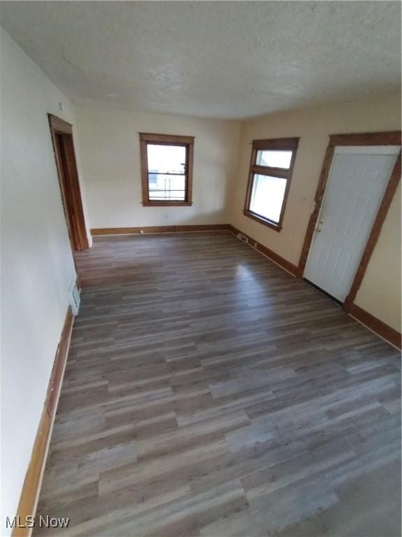 207 E Lucius Ave, Youngstown, OH 44507 - spare room featuring wood finished floors and a textured ceiling