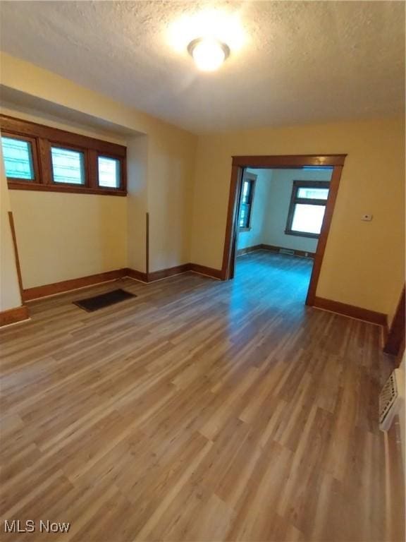207 E Lucius Ave, Youngstown, OH 44507 - unfurnished room featuring a textured ceiling and light wood-type flooring