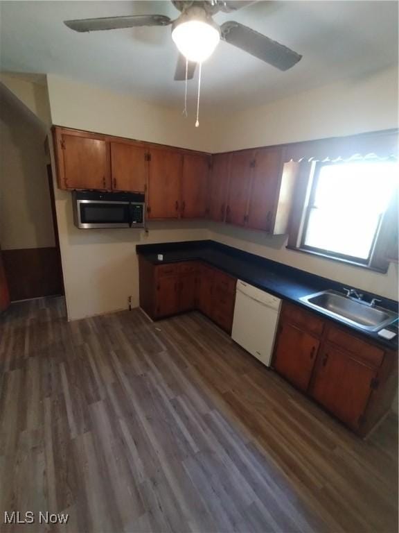 207 E Lucius Ave, Youngstown, OH 44507 - kitchen with dishwasher, stainless steel microwave, brown cabinets, wood finished floors, and a ceiling fan