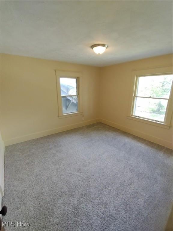 207 E Lucius Ave, Youngstown, OH 44507 - spare room with plenty of natural light and light carpet