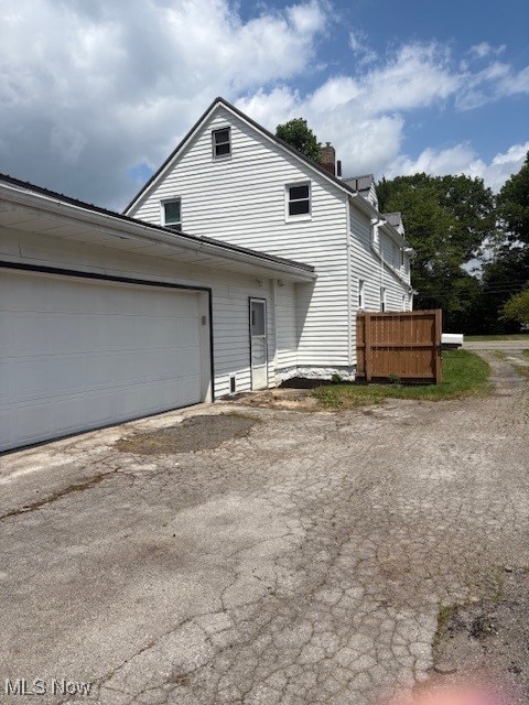 206 Fowler, Cortland, OH 44410 - view of front of property featuring driveway and a chimney