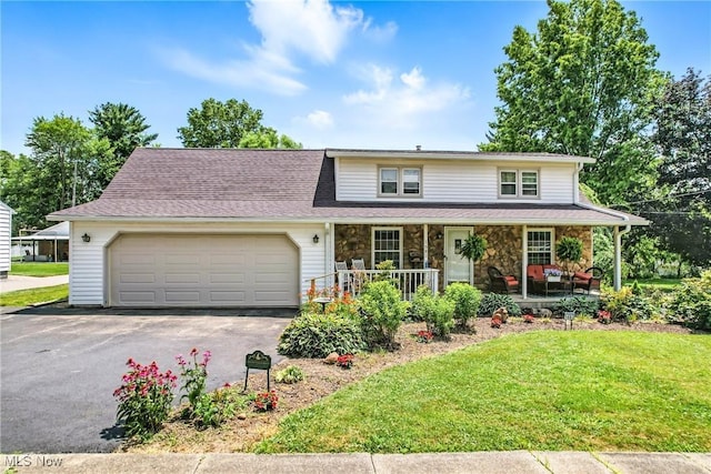 1683 Ridgewood Dr, Salem, OH 44460 - traditional home featuring a porch, a garage, driveway, a front yard, and stone siding