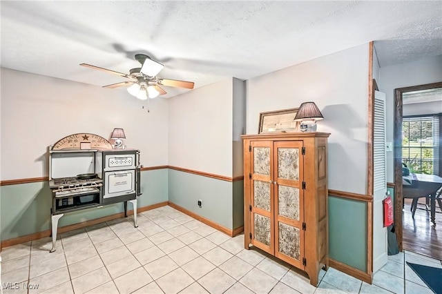 1683 Ridgewood Dr, Salem, OH 44460 - spare room with a ceiling fan, a textured ceiling, and light tile patterned floors
