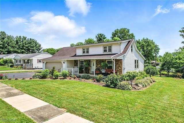 1683 Ridgewood Dr, Salem, OH 44460 - traditional-style house with a porch, stone siding, driveway, and a front yard