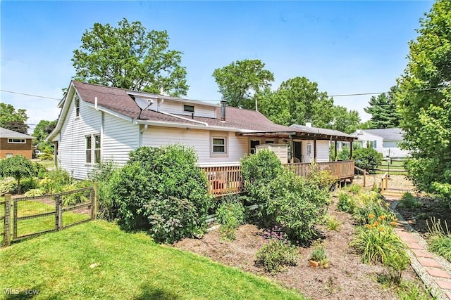 1683 Ridgewood Dr, Salem, OH 44460 - rear view of house with a deck and a shingled roof