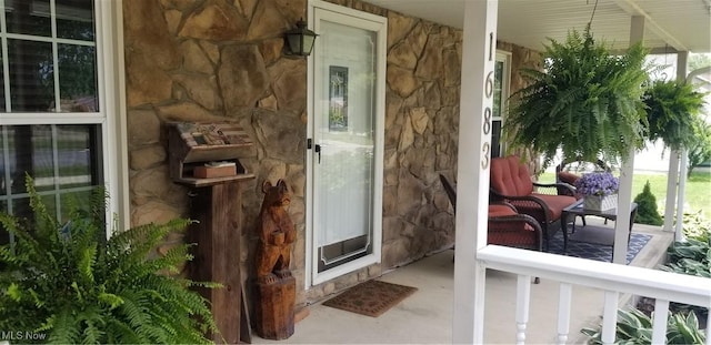 1683 Ridgewood Dr, Salem, OH 44460 - doorway to property with stone siding and a porch