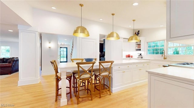 43 S St, Chagrin Falls, OH 44022 - kitchen with light wood-style flooring, light countertops, recessed lighting, white cabinetry, and pendant lighting