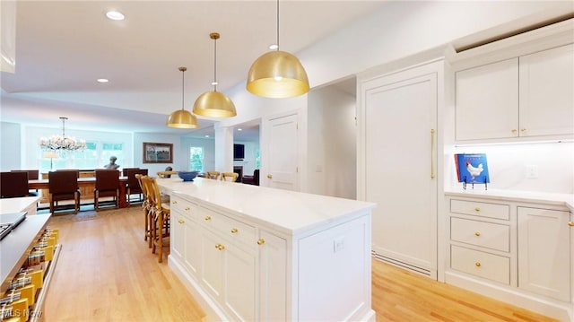 43 S St, Chagrin Falls, OH 44022 - kitchen featuring light wood finished floors, white cabinetry, pendant lighting, and recessed lighting