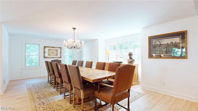 43 S St, Chagrin Falls, OH 44022 - dining area featuring a chandelier, light wood-style flooring, and healthy amount of natural light