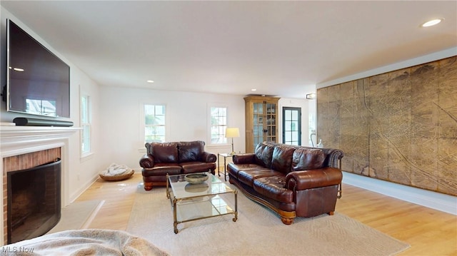 43 S St, Chagrin Falls, OH 44022 - living area featuring wood finished floors, a brick fireplace, and recessed lighting