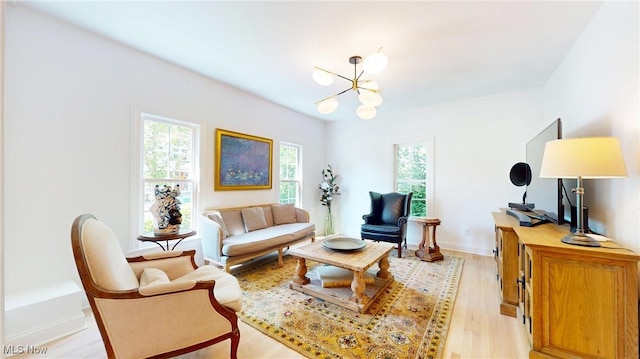 43 S St, Chagrin Falls, OH 44022 - living room featuring a chandelier and light wood finished floors