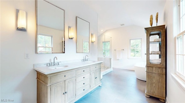 43 S St, Chagrin Falls, OH 44022 - bathroom featuring plenty of natural light, double vanity, a freestanding tub, a stall shower, and lofted ceiling
