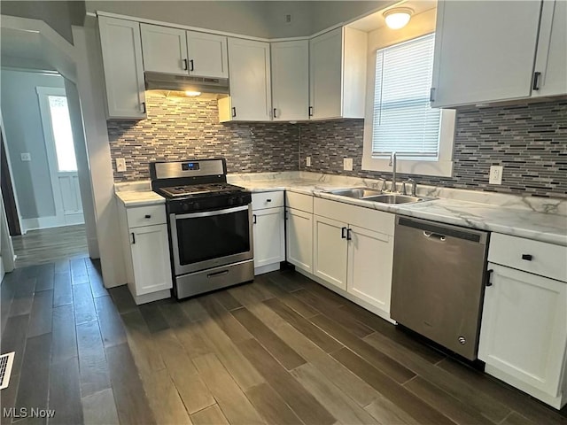 38 Franklin Ave, Niles, OH 44446 - kitchen with appliances with stainless steel finishes, under cabinet range hood, dark wood-style floors, and white cabinets