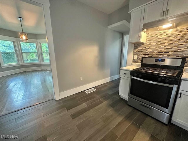 38 Franklin Ave, Niles, OH 44446 - kitchen featuring stainless steel gas range oven, under cabinet range hood, light countertops, white cabinetry, and dark wood-style floors