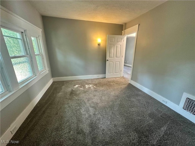 38 Franklin Ave, Niles, OH 44446 - carpeted spare room featuring baseboards and a textured ceiling