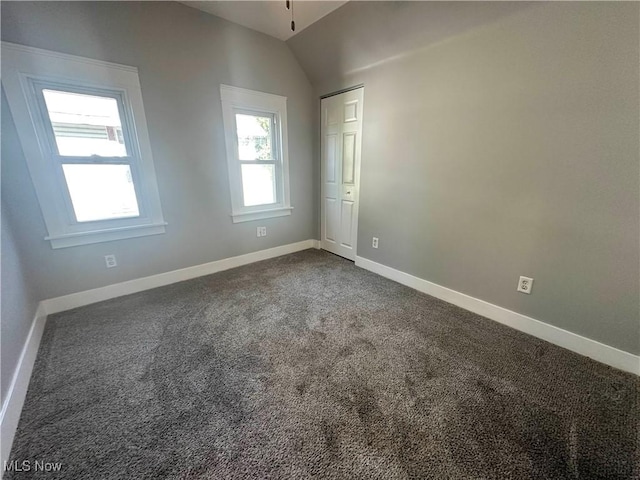 38 Franklin Ave, Niles, OH 44446 - spare room featuring dark carpet and vaulted ceiling