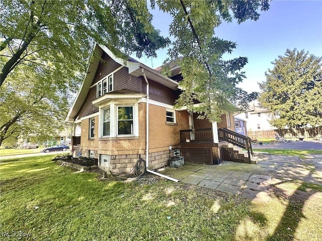 38 Franklin Ave, Niles, OH 44446 - view of home's exterior with a lawn and brick siding