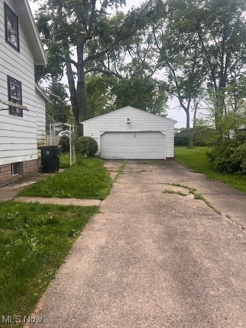 1767 Northfield, Warren, OH 44485 - view of side of property with a detached garage and an outbuilding