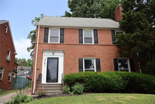 3781 Washington Blvd, University Heights, OH 44118 - view of front of house with brick siding, entry steps, and a chimney